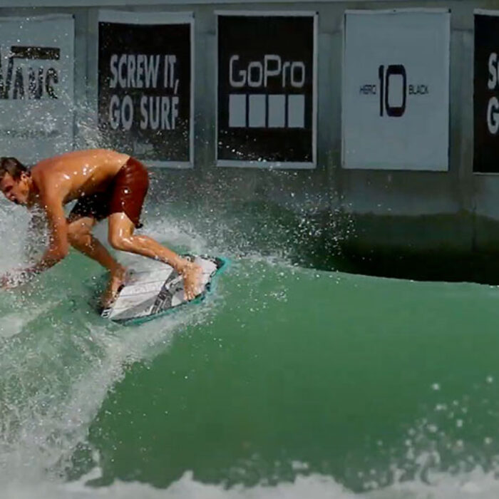 Koa Smith skim boarding in a pool
