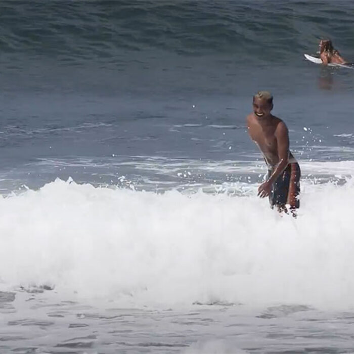 Ketut Agus surfing in Bali