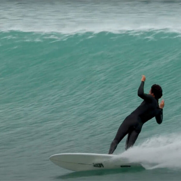 Mikey February surfing