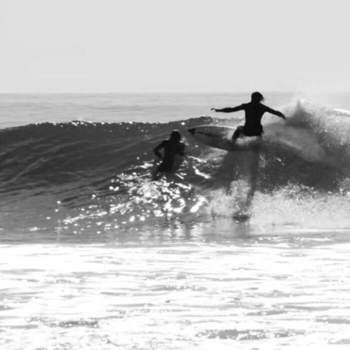Rincon Surfers almost collide Human Boardslide