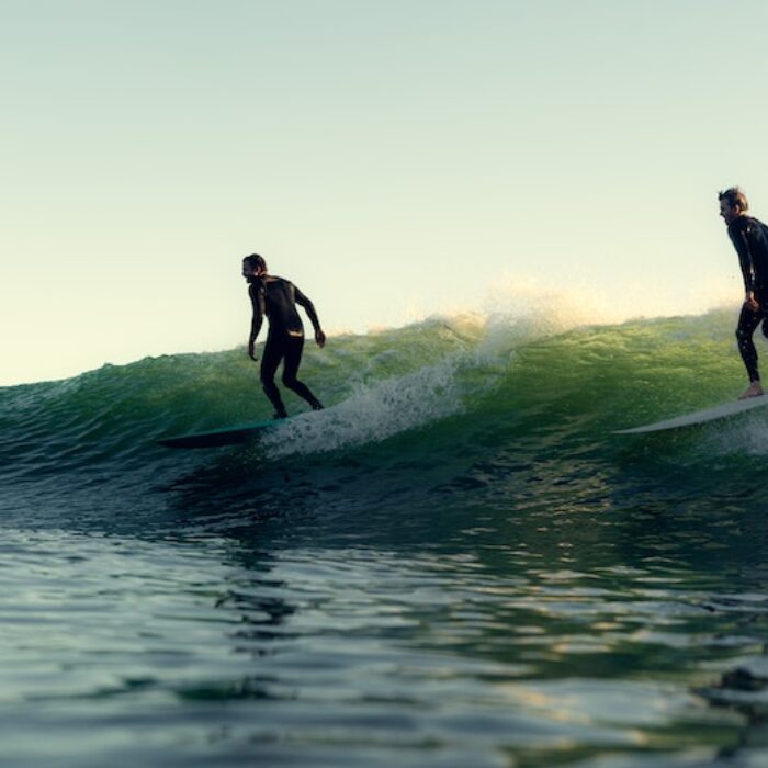 surfers party wave