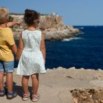 kids standing on cliff