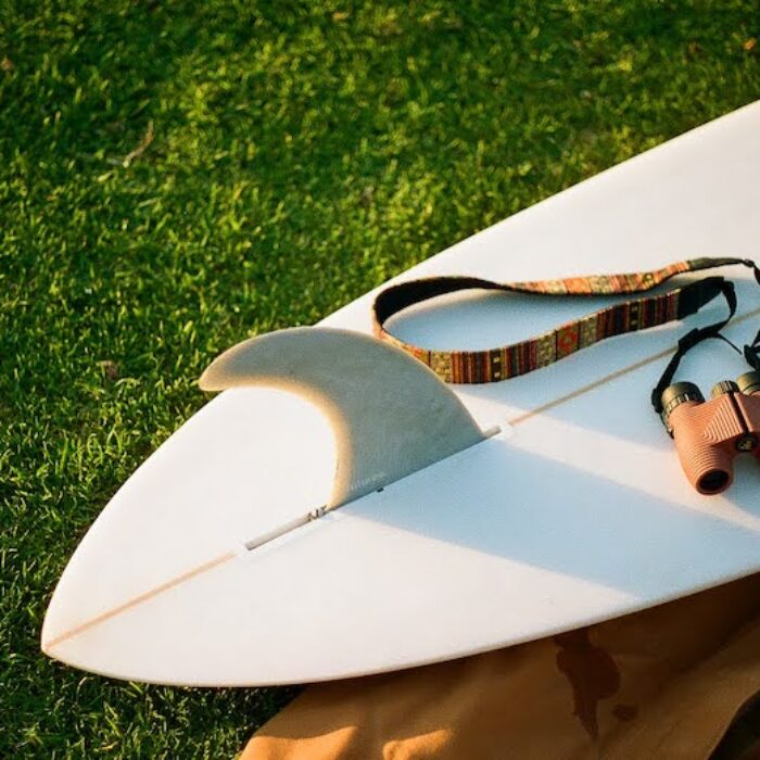 Nocs binoculars on a surfboard