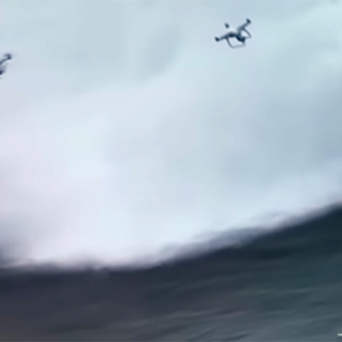 Watch These Two Drones Collide, Nearly Taking Out a Surfer