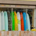 surf shop window of surfboards