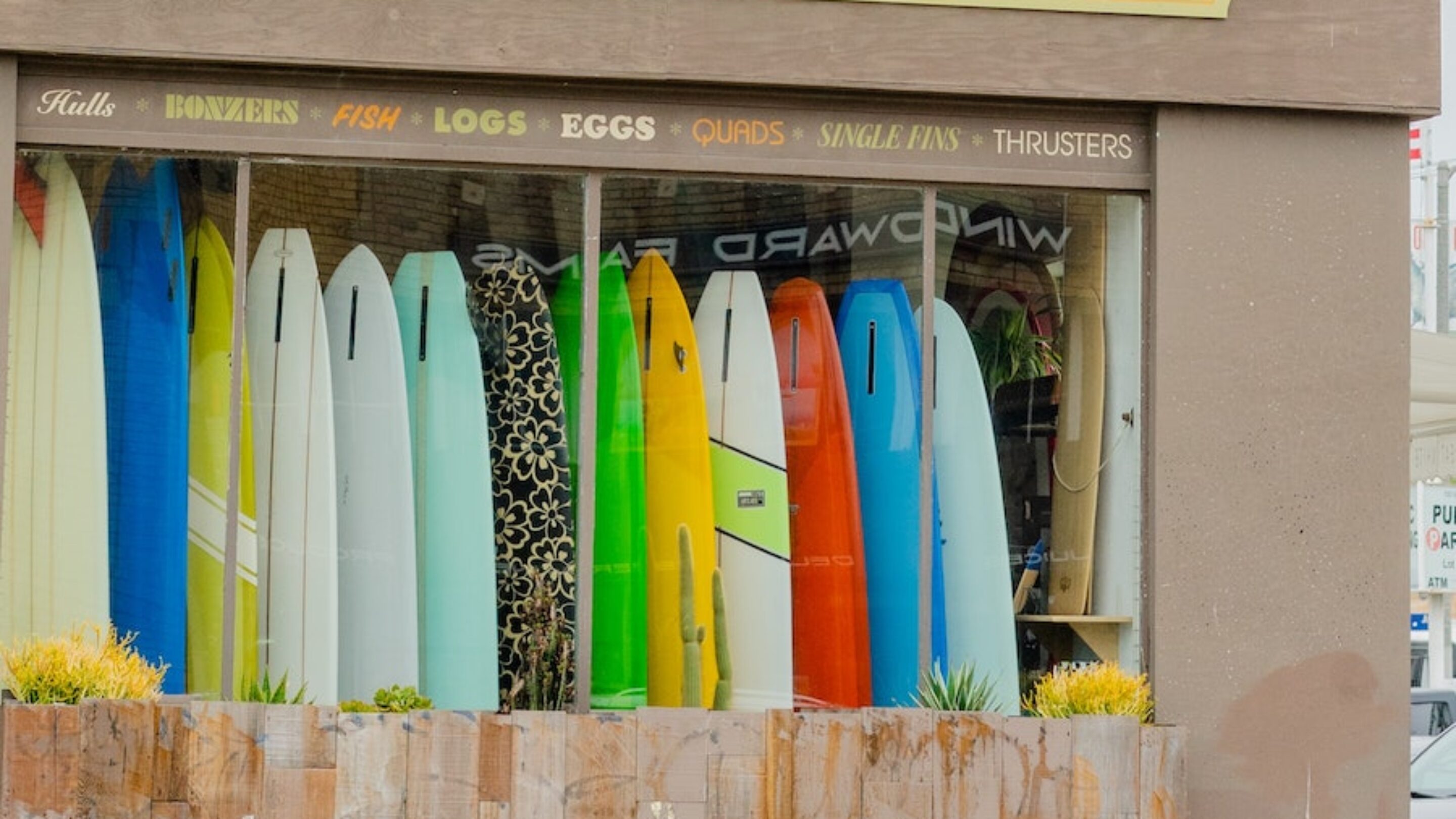 surf shop window of surfboards