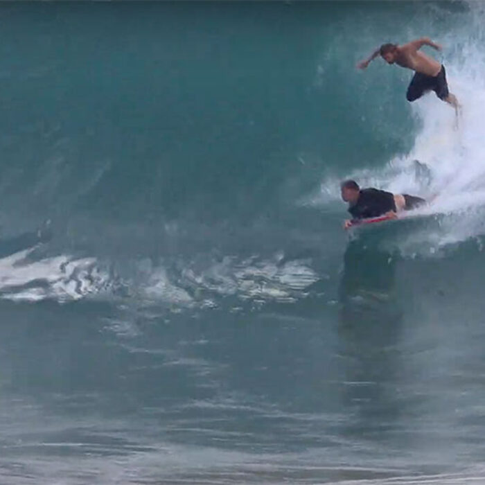 kirra surfing with surfer and bodyboarder