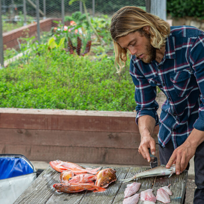 Conner Coffin cutting fish