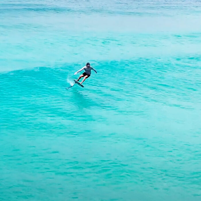 foil surfing by Adam Bennetts