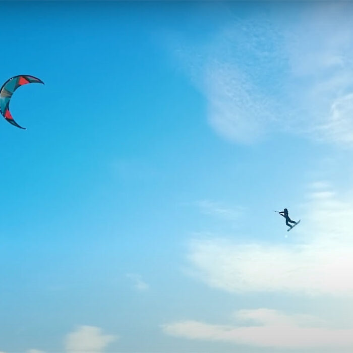 Parasailing behind snowmobile