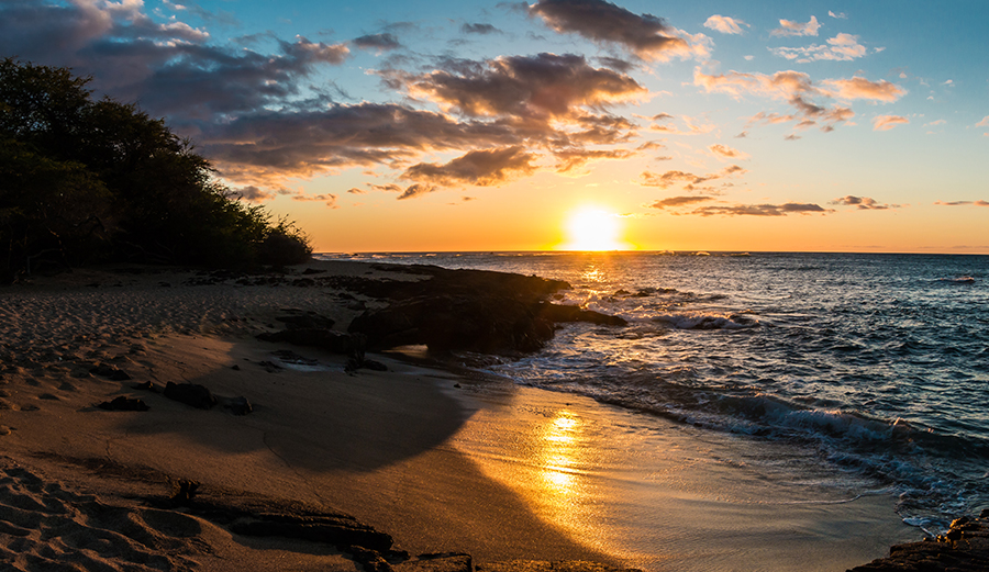 a sunset at ʻAnaehoʻomalu Bay on Hawai‘i Island