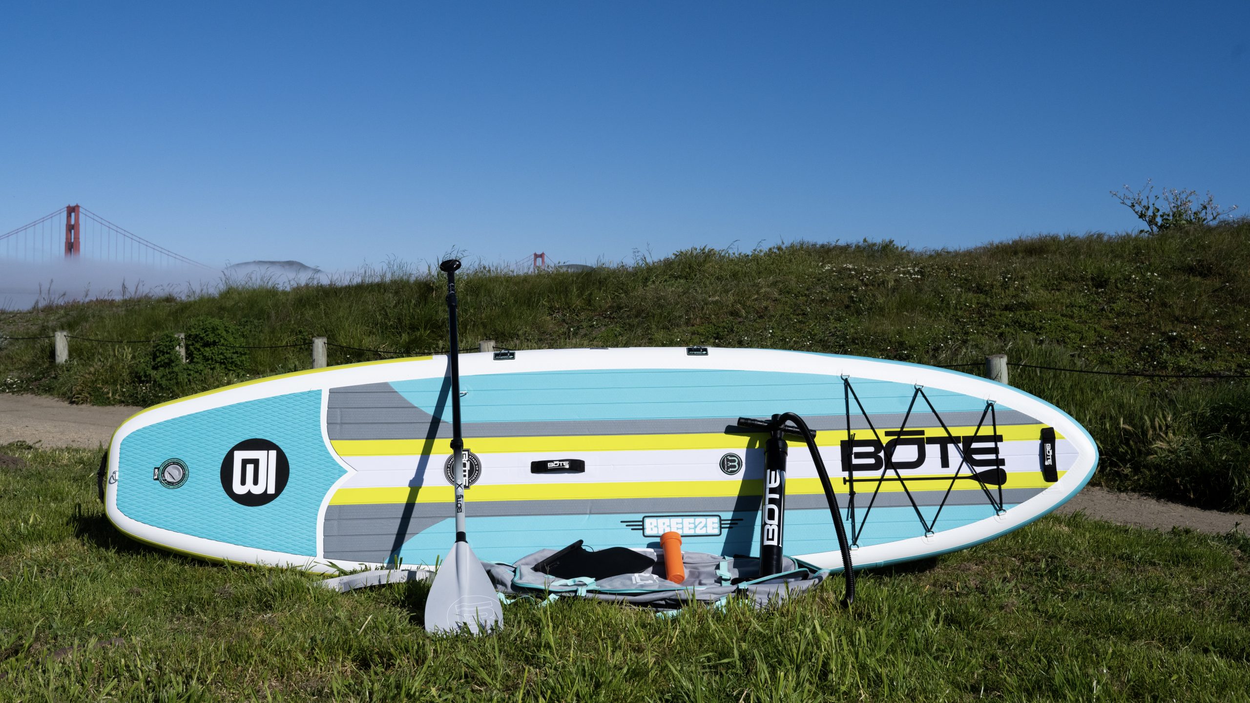 bote breeze aero inflatable paddle board and accessories with golden gate bridge in background
