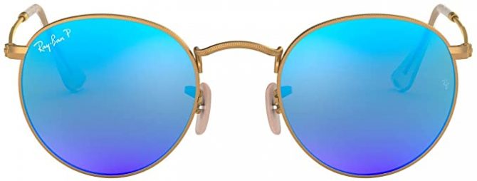 Ray-ban sunglasses with a blue tint and gold frame, circular shape.