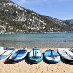 beach lineup of paddle boards that we tested