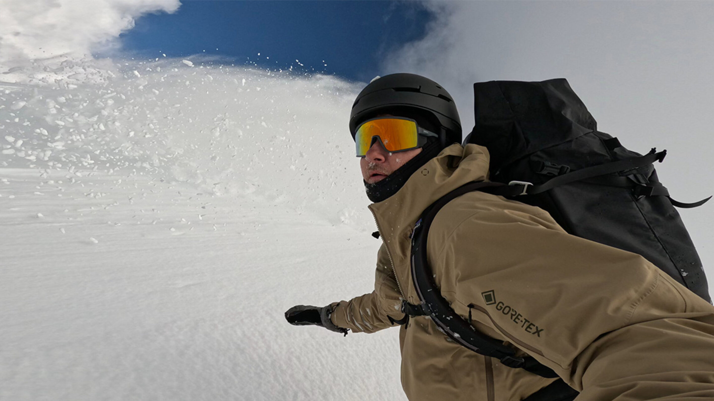 snowboarding in powder with smith pursuit backcountry glasses