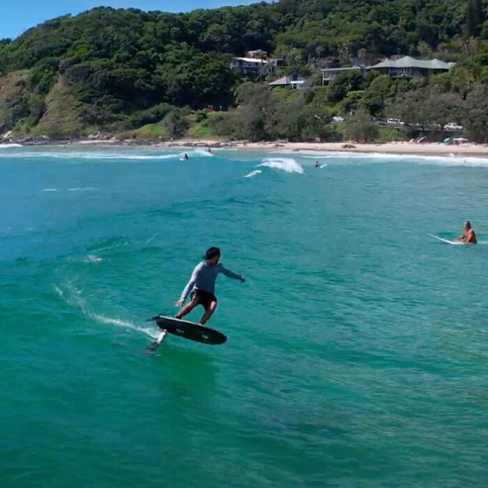 Adam Bennetts foil surfing in Byron bay
