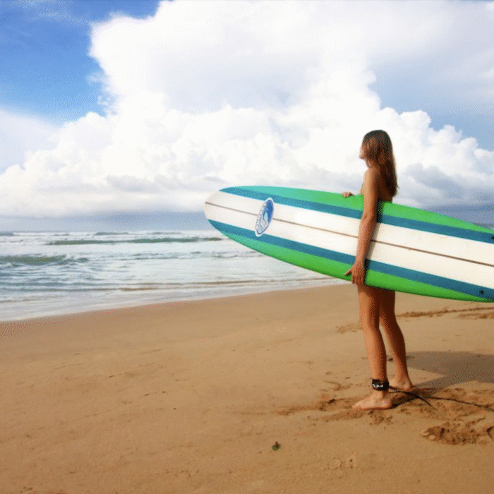 Paddling out on a longboard.