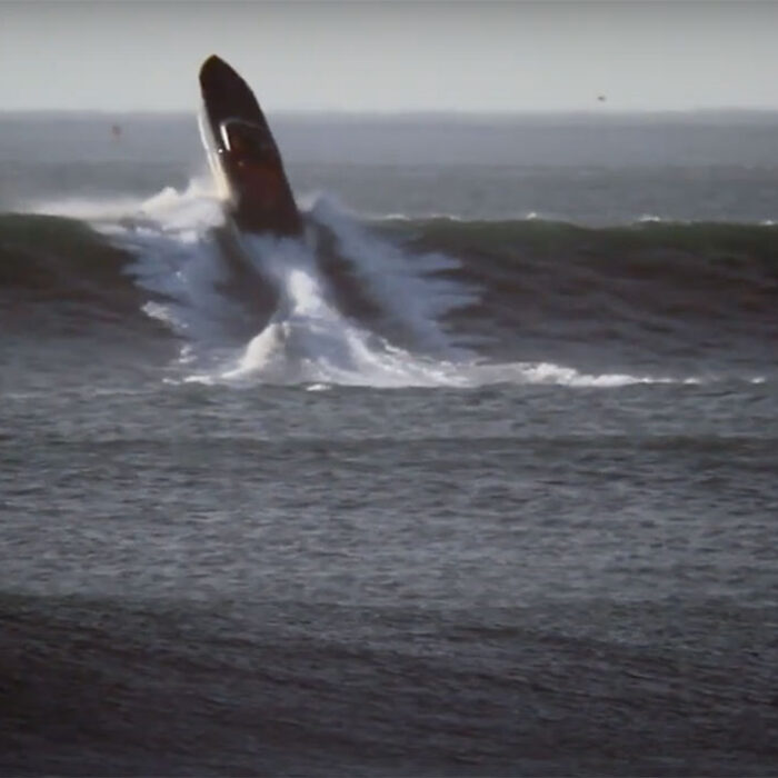 Cigarette Boat on wave at Ocean Beach