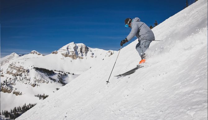 a man skis down a hill
