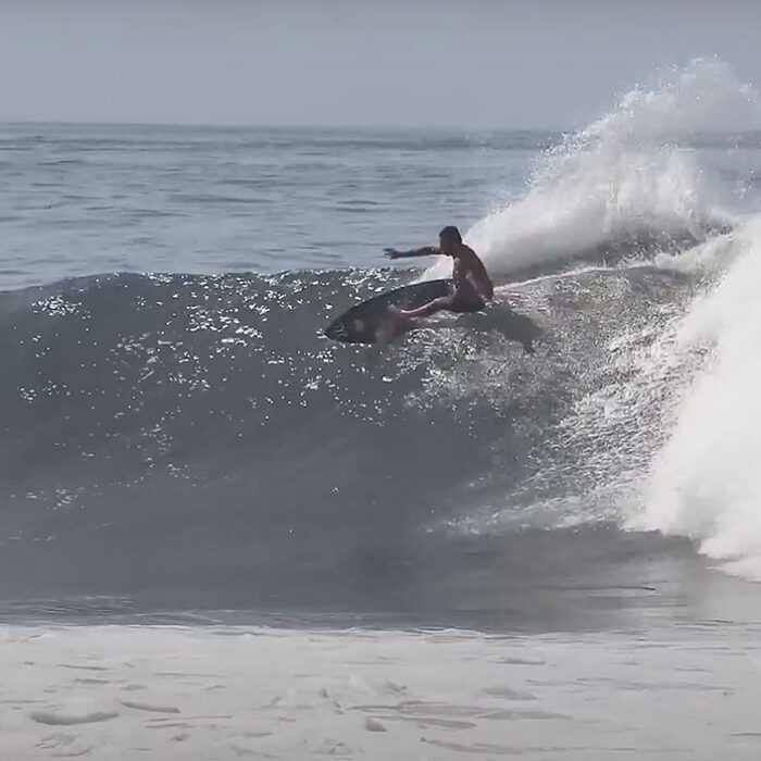 Kai Lenny surfing Keramas