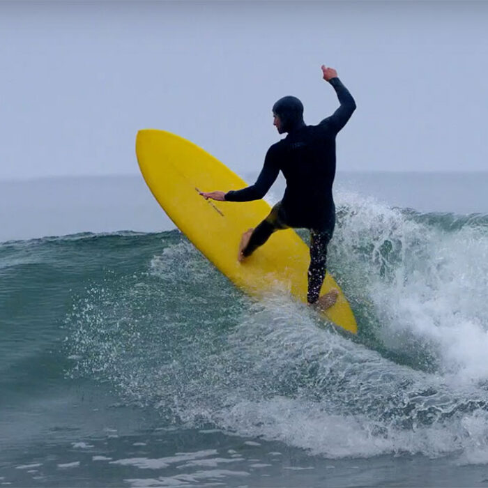 Alex Gray surfing mid-length surfboard