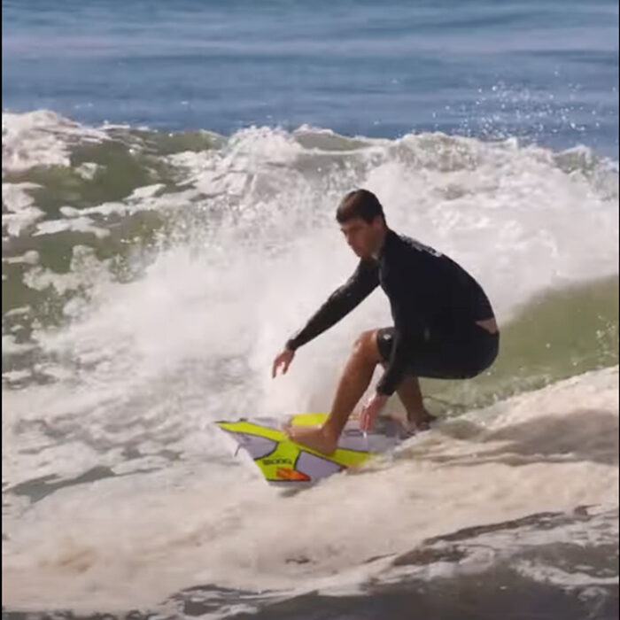 Jack Robinson riding half a board.