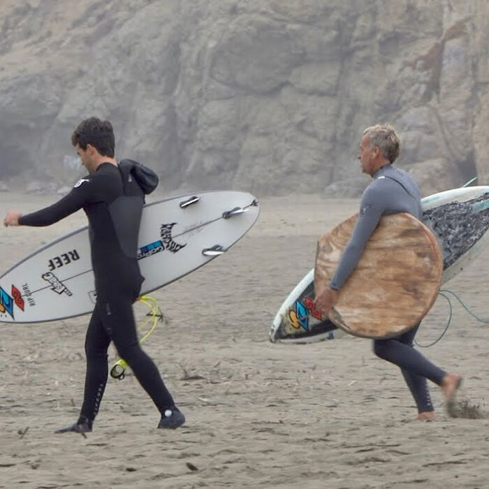Tom Curren and Mason Ho with surfboards