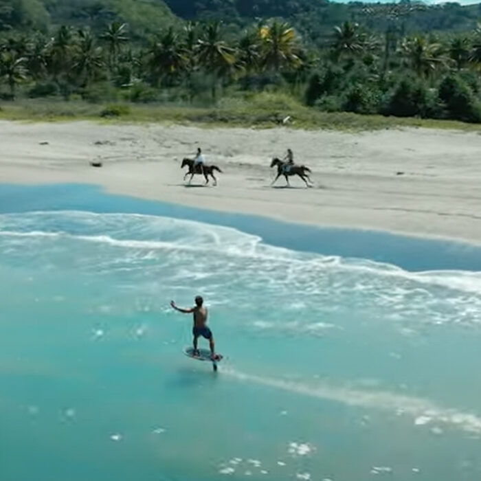 Kai Lenny gets towed by a horse.