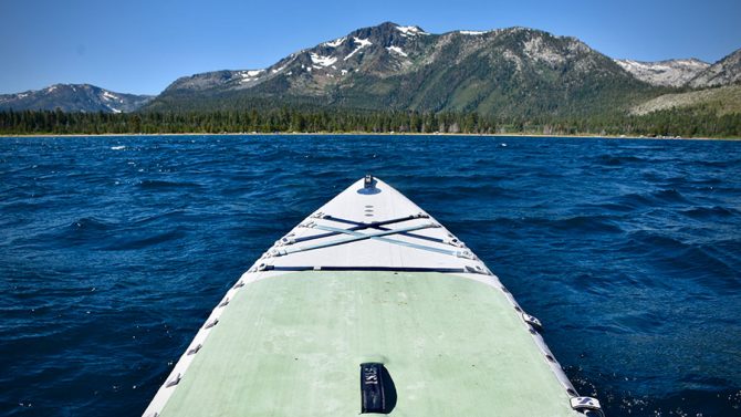 The Isle Explorer Pro inflatable paddleboard on the choppy waters of Lake Tahoe.