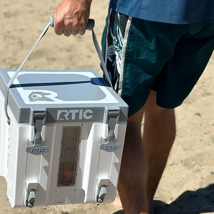 the RTIC halftime cooler being carried on the beach while being tested for our review.