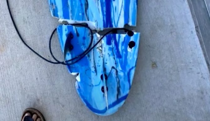 Toby Begg's surfboard, broken in half by the shark that bit him. Source: 9 News Australia // Youtube