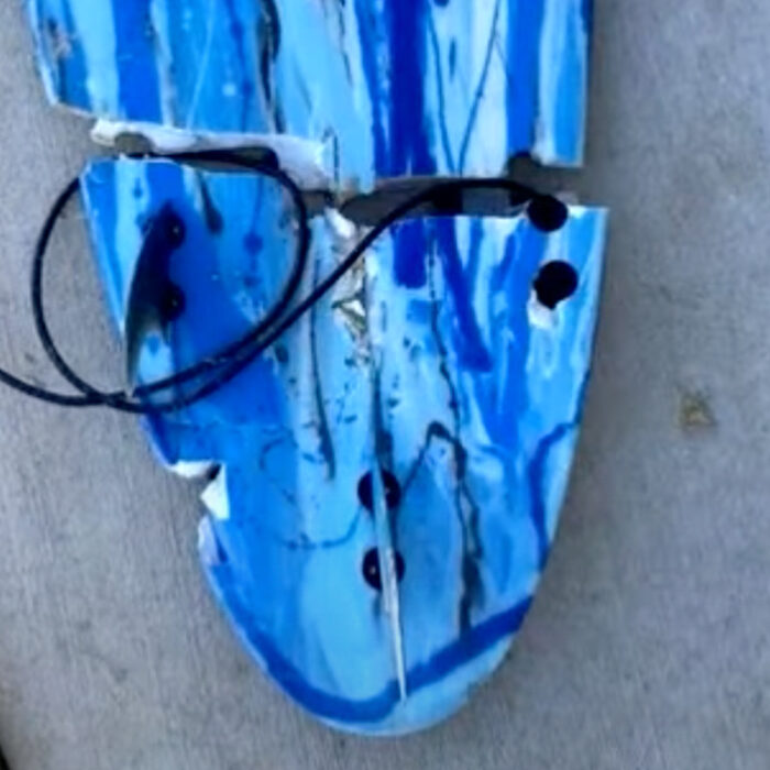 Toby Begg's surfboard, broken in half by the shark that bit him. Source: 9 News Australia // Youtube