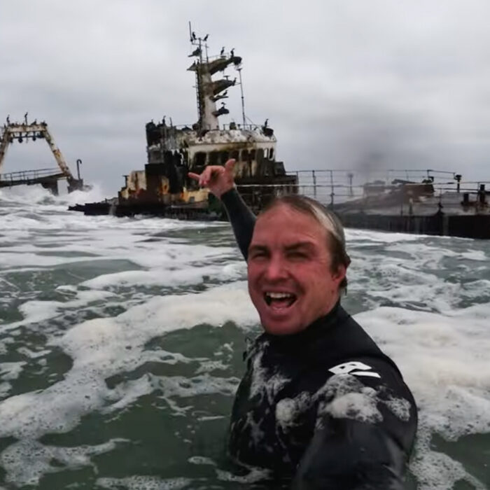 Jamie O'Brien surfs a shipwreck.