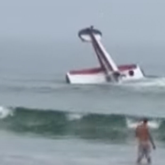 Plane crashes off New Hampshire beach.