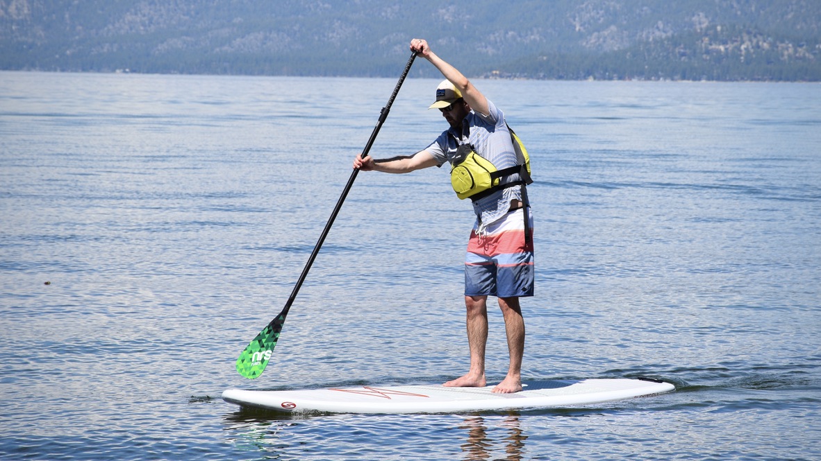 Man paddle boarding on Lake Tahoe using the NRS Rush SUP Paddle