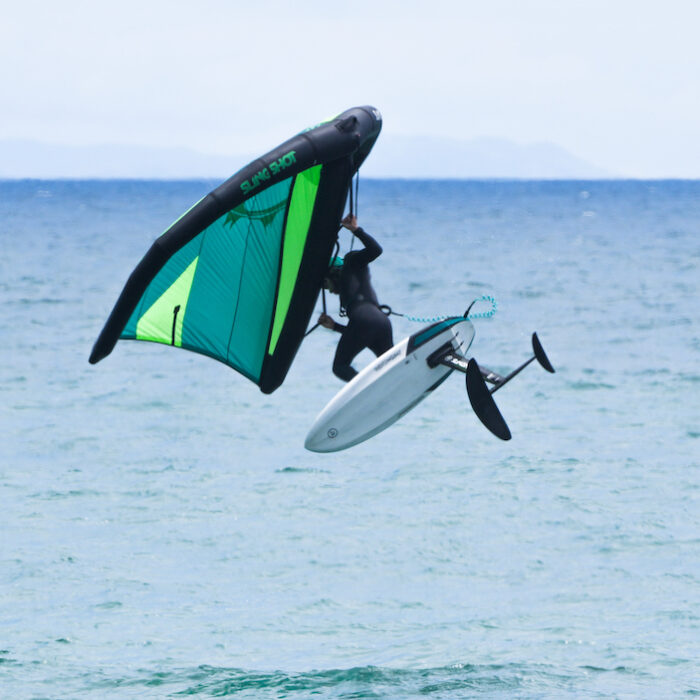 Jesse Faen jumping on a wing foil