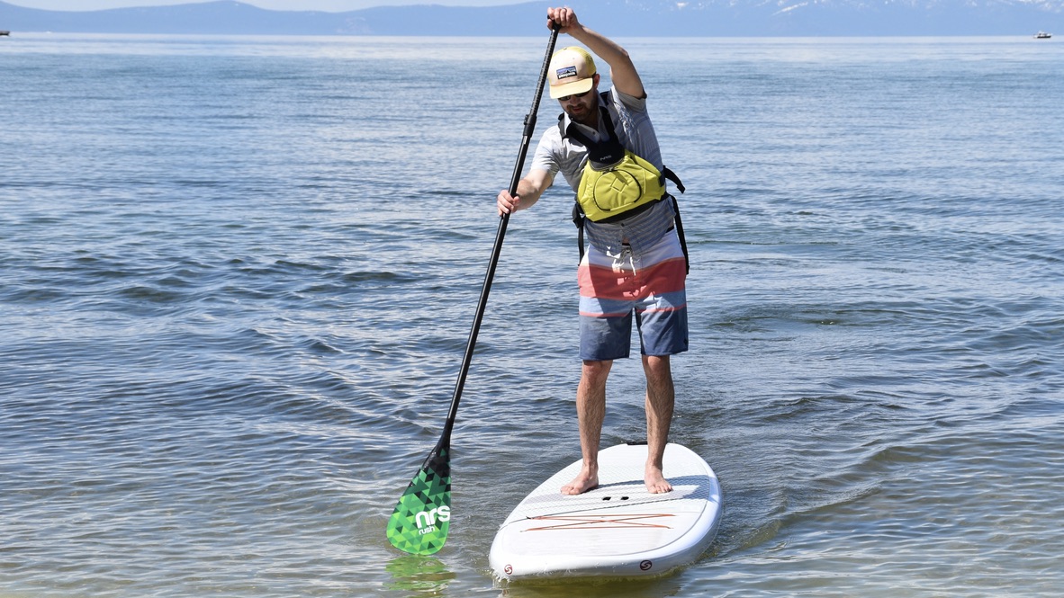 man paddle boarding on lake tahoe with the NRS Rush SUP paddle