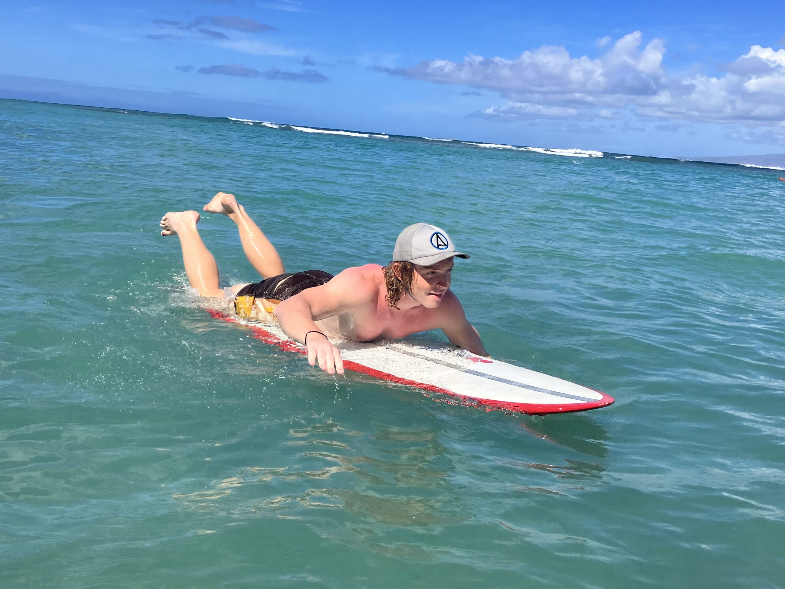 a man wearing one of the surf hats we tested for this guide