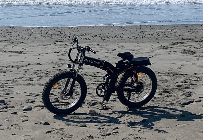 the engwe x24 fat tire electric bike on the beach