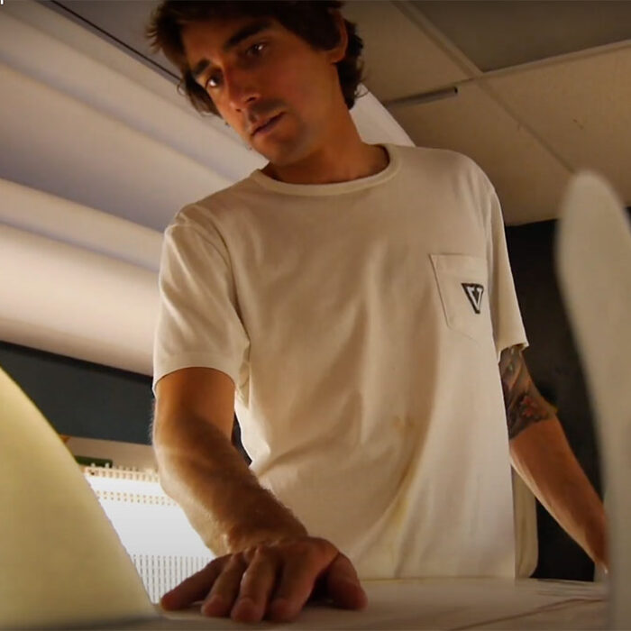 Alex Lopez shaping surfboard