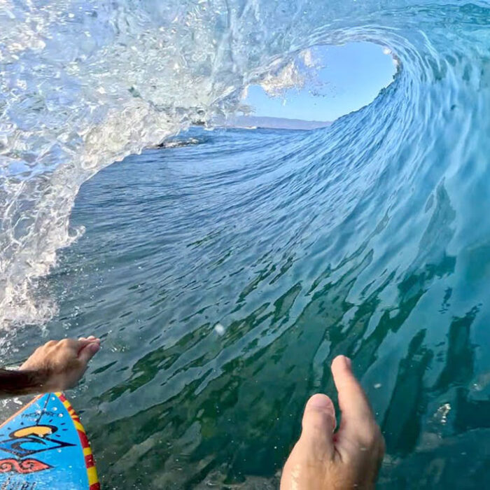 Mason Ho surfing on rocks