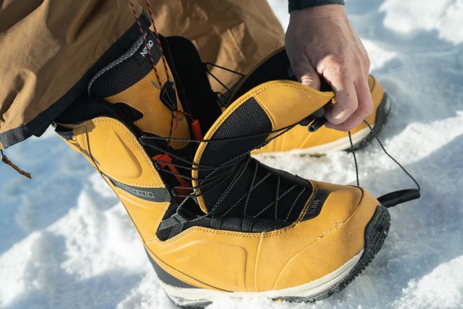 showing the tongue lace system on the nitro team tls snowboard boots for our review