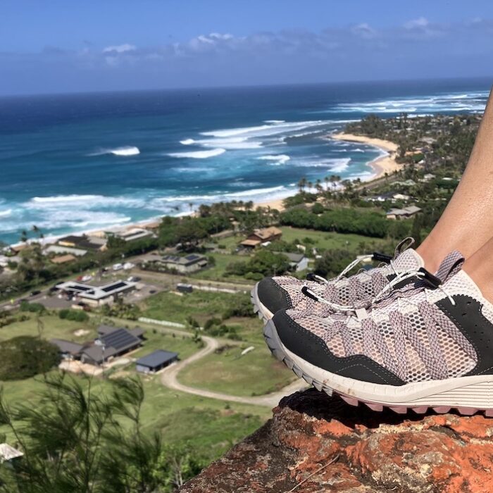 watershoes on the edge of a cliff with an ocean view