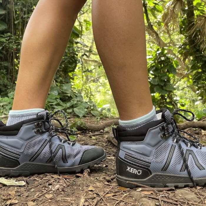 feet in hiking boots in the forest