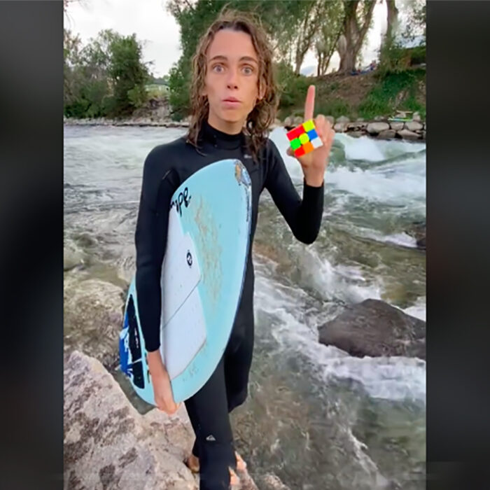 Watch This Skimboarder Solve a Rubik’s Cube in Under 2 Minutes While Riding a River Wave