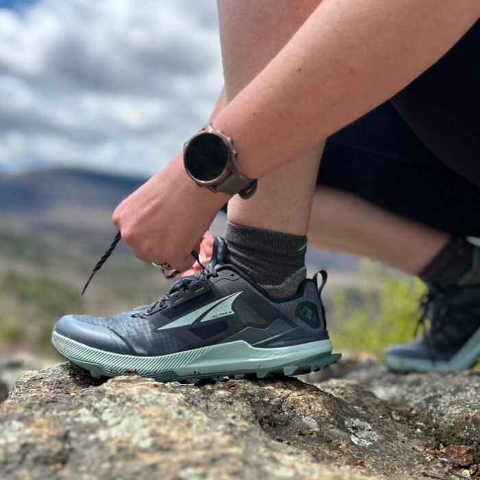 lacing up the Altra Lone Peak 8 hiking shoes