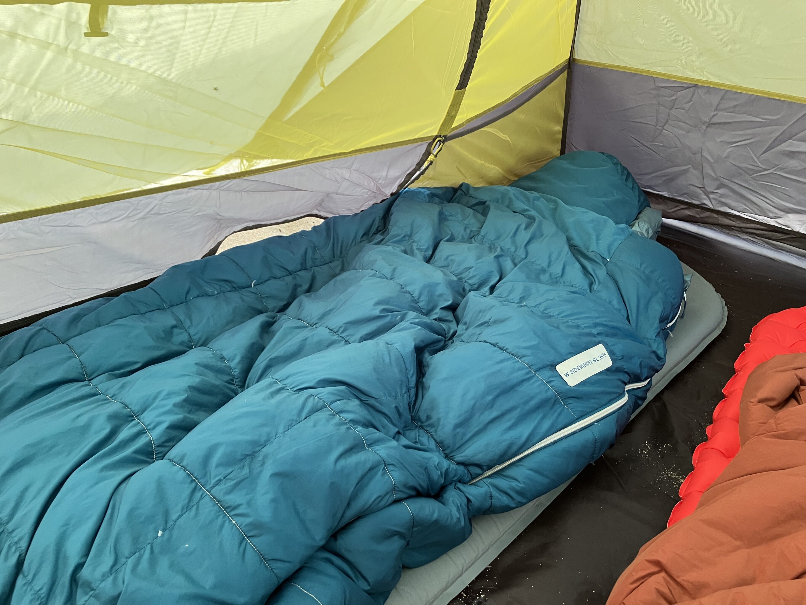 a sleeping pad and sleeping bag inside a tent
