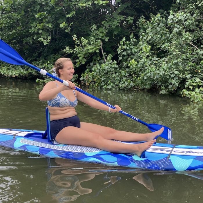 a woman paddling on the Wavestorm SUP Yak
