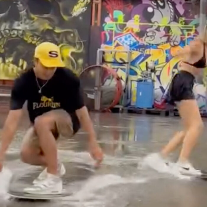 Adrien Raza and Sterre Meijer skim a flooded skate park. Photo: Adrien Raza // Instagram