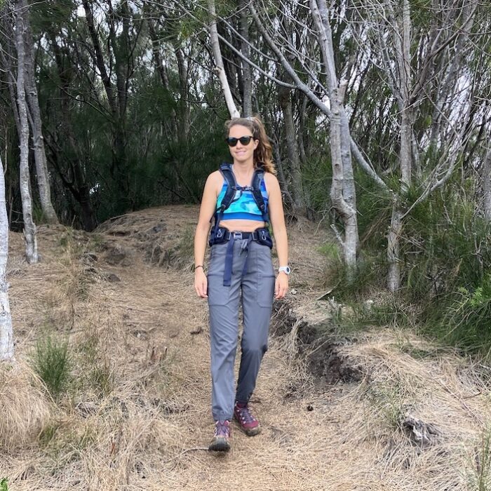 a woman hiking in patagonia hiking pants